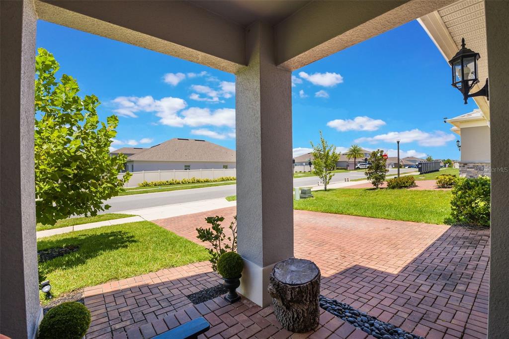 1108 Cavender Creek Road Minneola, FL 34715 - Photo 5 of 54 a view of a porch with a yard