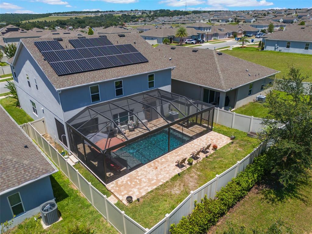 1108 Cavender Creek Road Minneola, FL 34715 - Photo 51 of 54 an aerial view of a house with a backyard