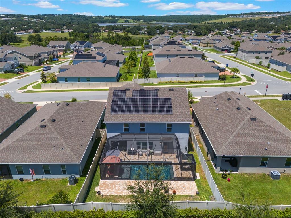 1108 Cavender Creek Road Minneola, FL 34715 - Photo 52 of 54 an aerial view of residential houses with outdoor space and swimming pool