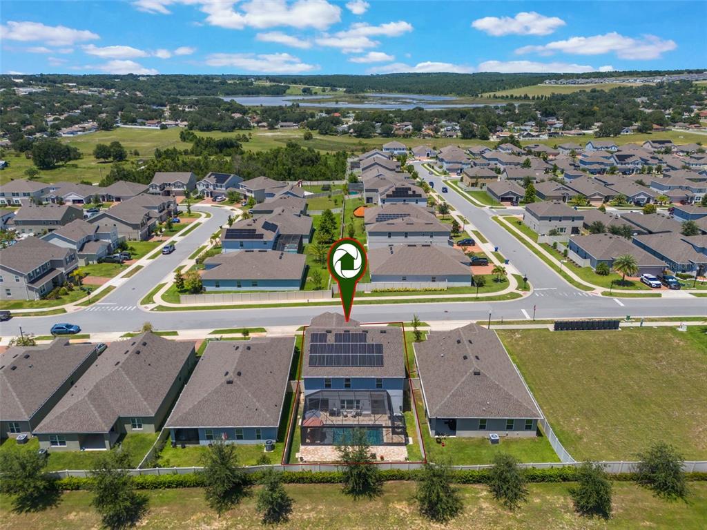 1108 Cavender Creek Road Minneola, FL 34715 - Photo 53 of 54 an aerial view of residential houses with outdoor space
