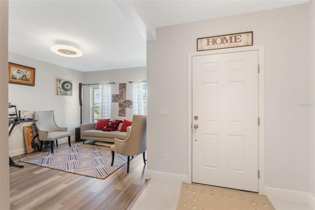 1108 Cavender Creek Road Minneola, FL 34715 - Photo 7 of 54 a living room with furniture and a window