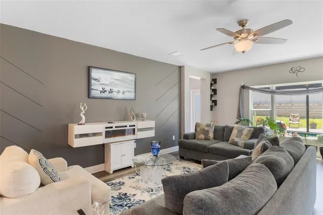 a living room with furniture and a large window