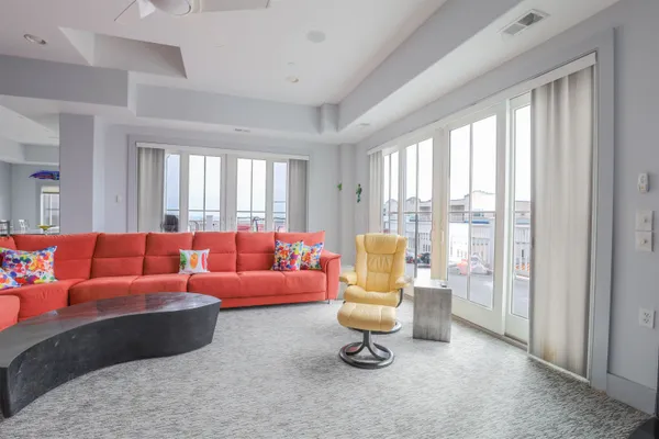 a living room with furniture and a large window