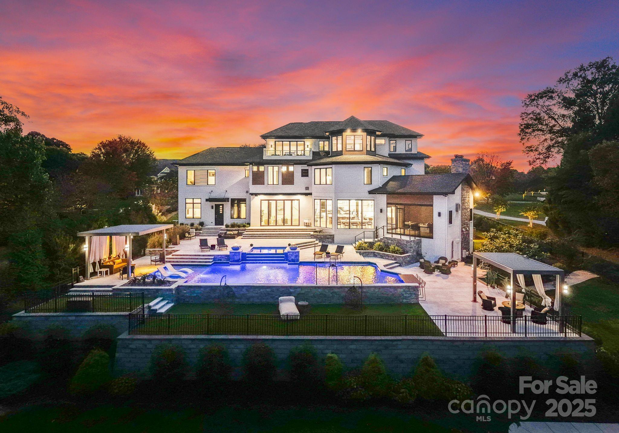 134 Cape Cod Way Mooresville, NC 28117 - Photo 1 of 46 a front view of a house with a garden and lake view