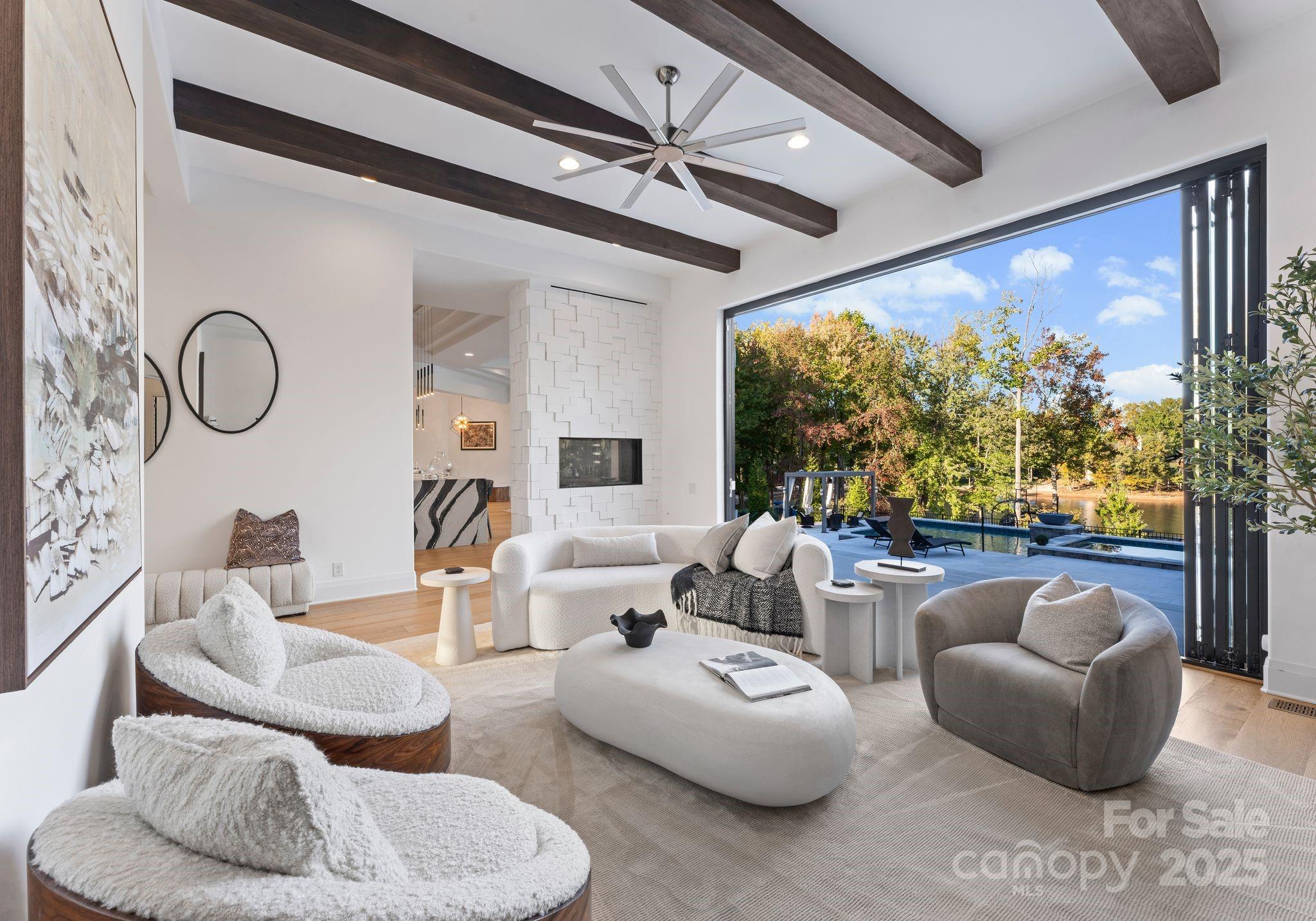134 Cape Cod Way Mooresville, NC 28117 - Photo 14 of 46 a living room with furniture a chandelier and a large window
