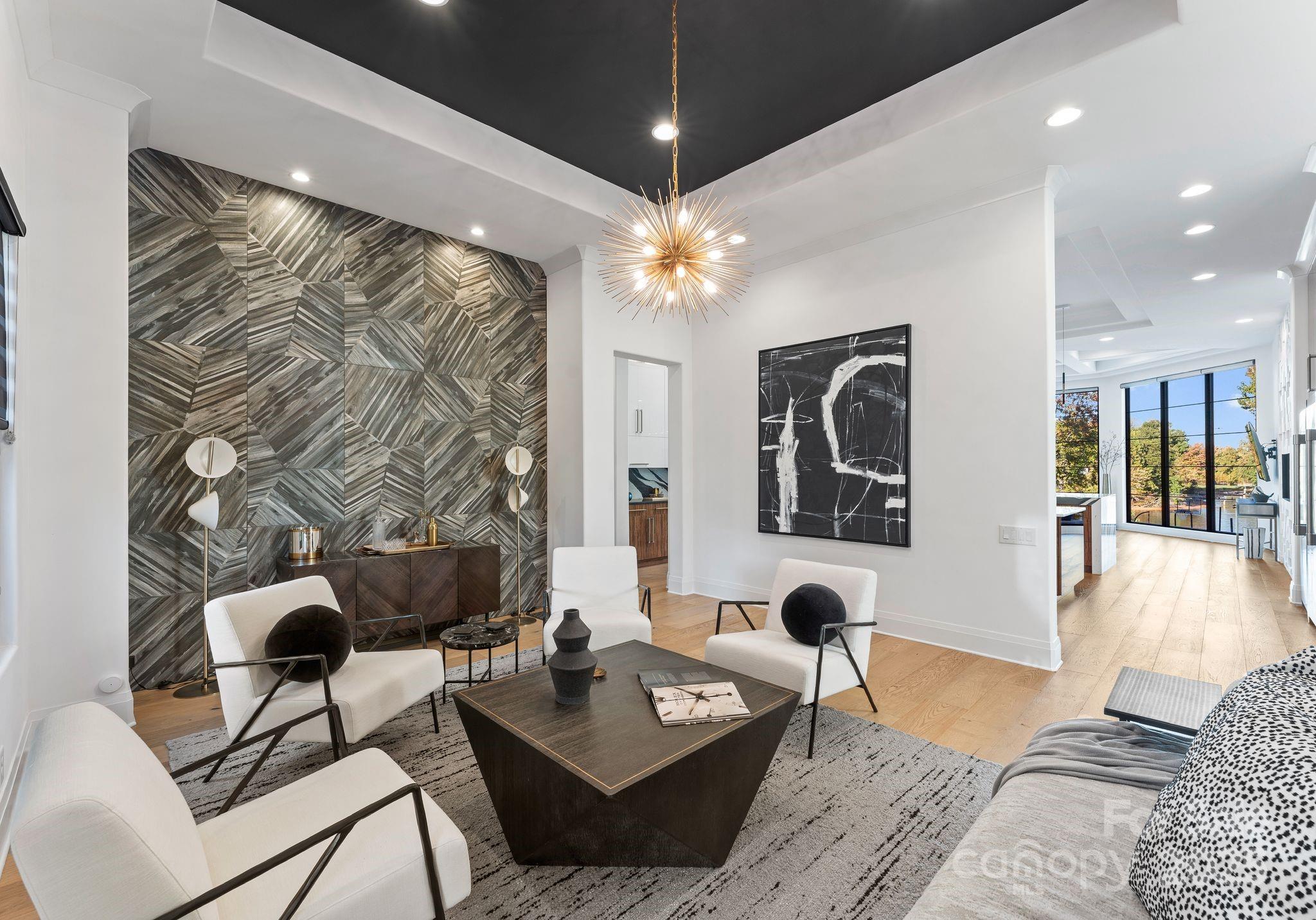 134 Cape Cod Way Mooresville, NC 28117 - Photo 17 of 46 a living room with furniture and a chandelier