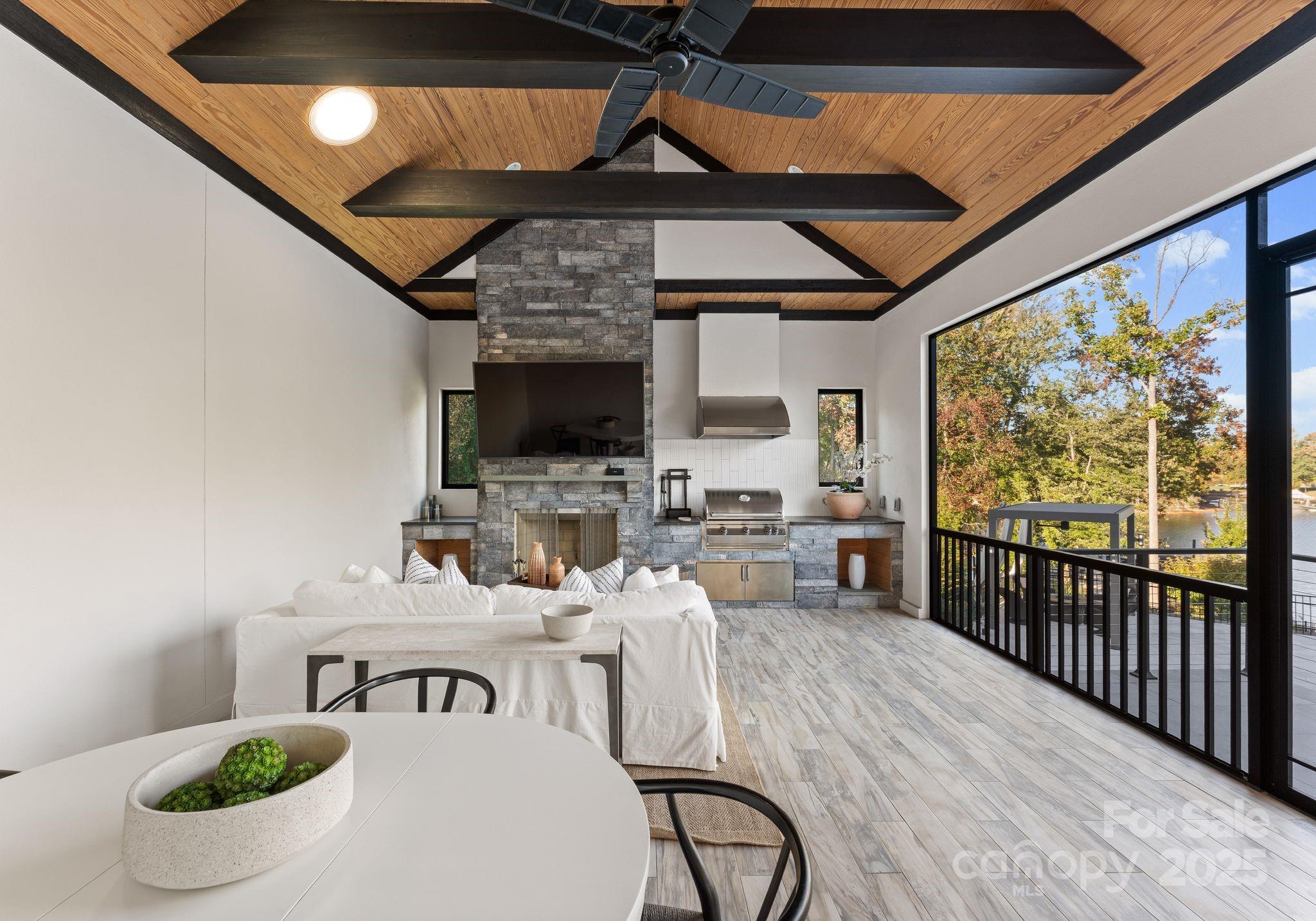 134 Cape Cod Way Mooresville, NC 28117 - Photo 21 of 46 a living room with furniture a fireplace and a flat screen tv