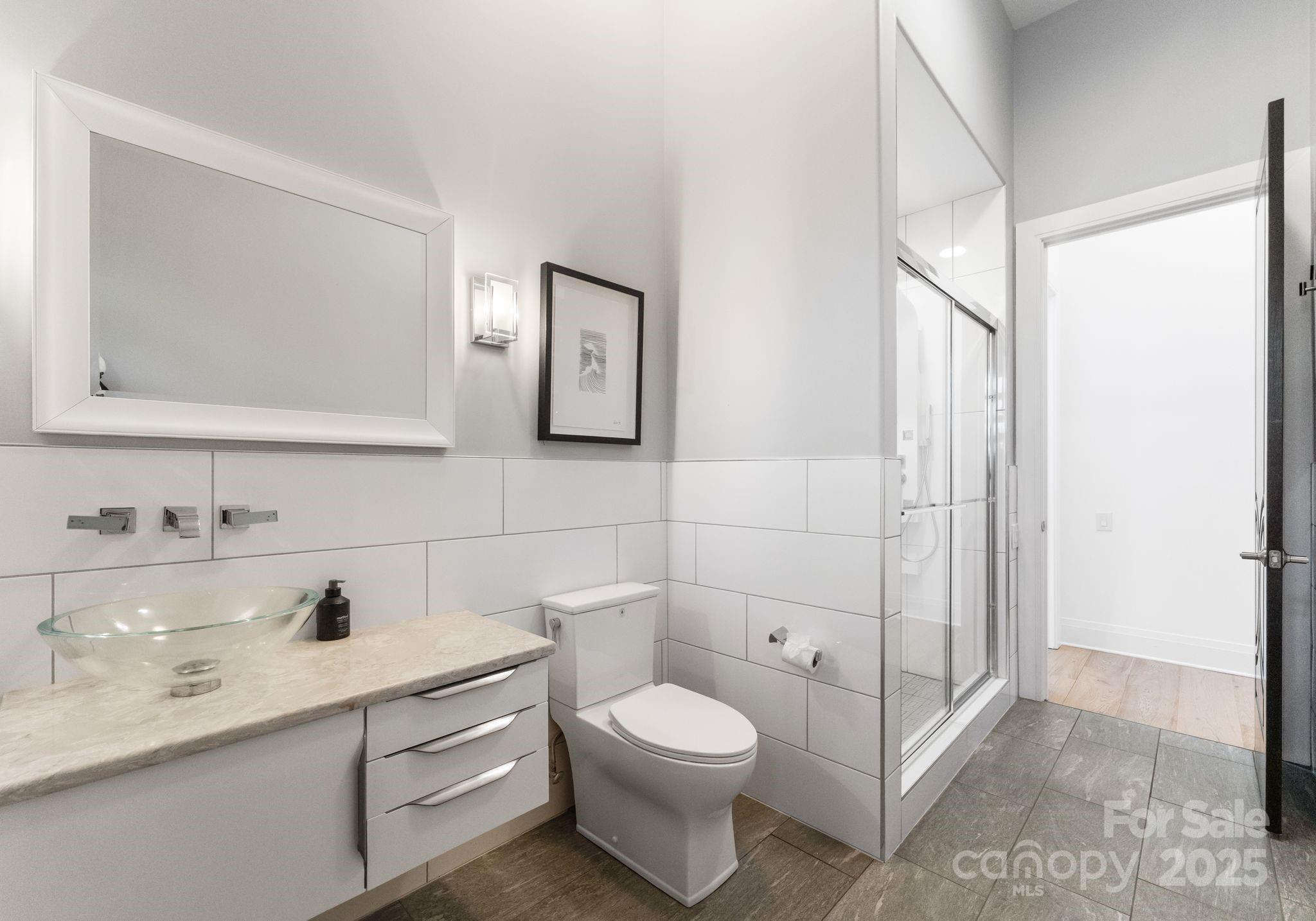 134 Cape Cod Way Mooresville, NC 28117 - Photo 23 of 46 a bathroom with a toilet a sink and mirror