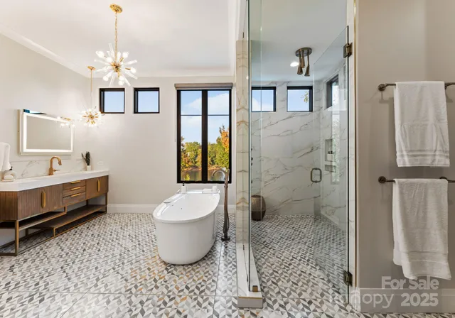a spacious bathroom with a toilet sink and shower