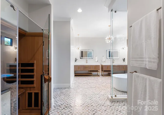 a bathroom with a double vanity sink a mirror and a shower