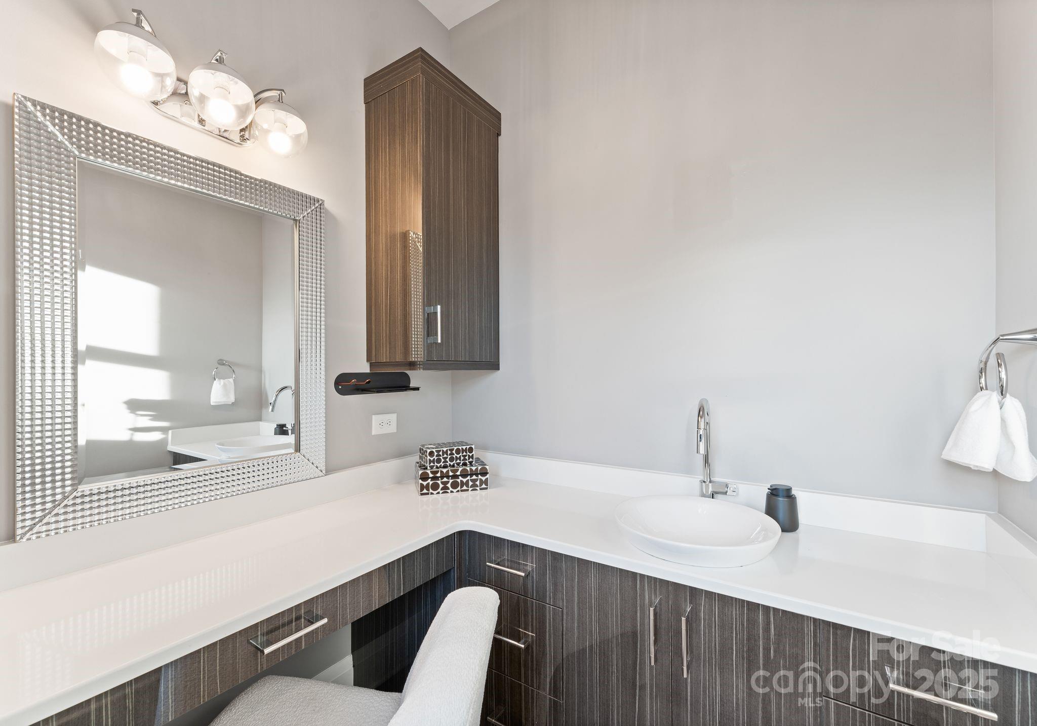 134 Cape Cod Way Mooresville, NC 28117 - Photo 30 of 46 a kitchen with a sink and a mirror
