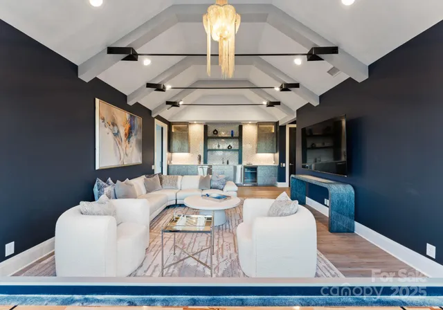 a living room with fireplace furniture and a flat screen tv