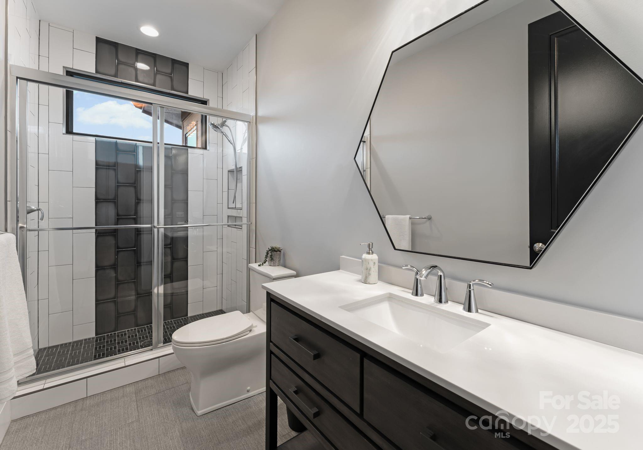 134 Cape Cod Way Mooresville, NC 28117 - Photo 41 of 46 a bathroom with a sink a toilet and shower