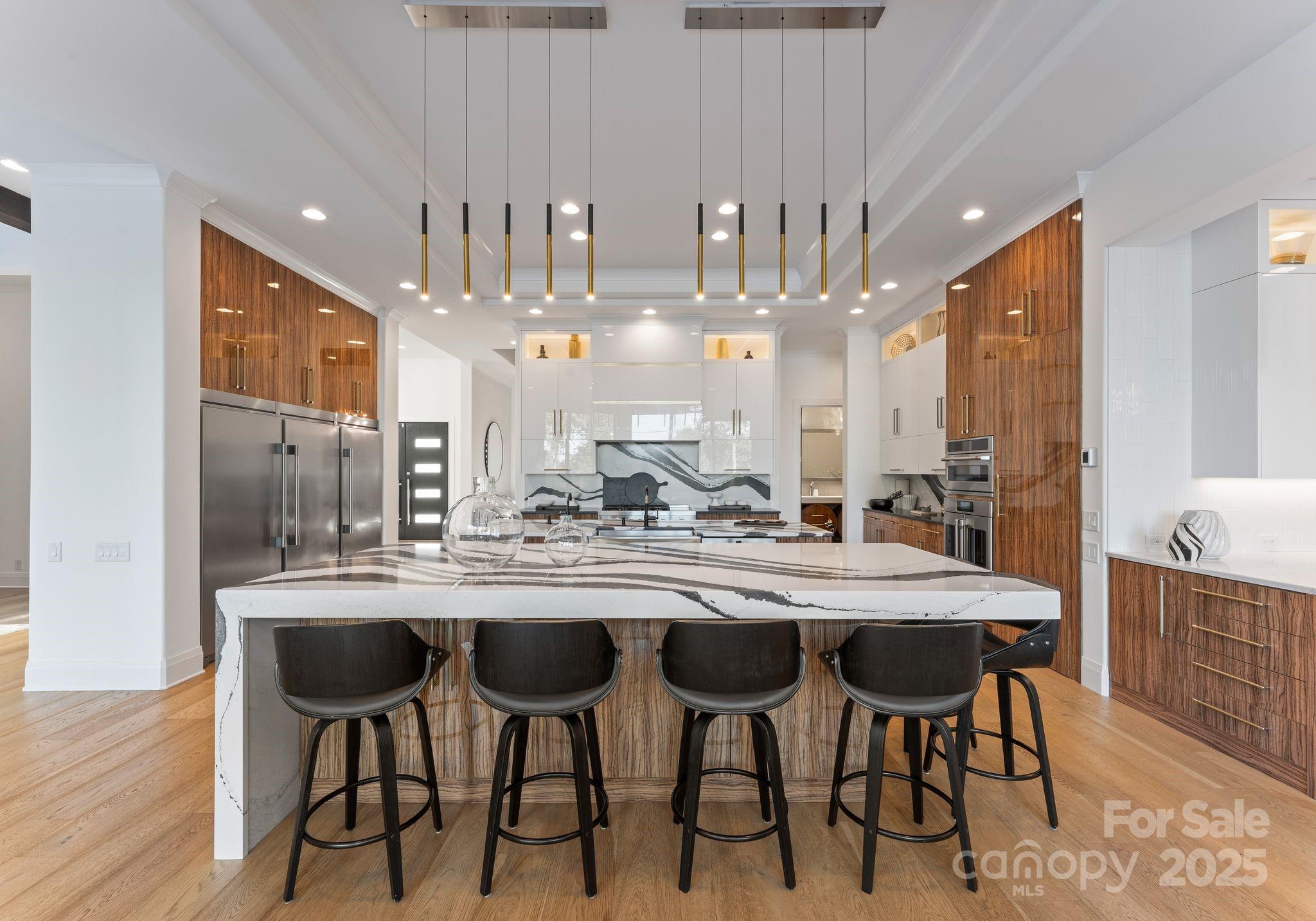 134 Cape Cod Way Mooresville, NC 28117 - Photo 10 of 46 a kitchen with kitchen island granite countertop lots of counter top space and dining table