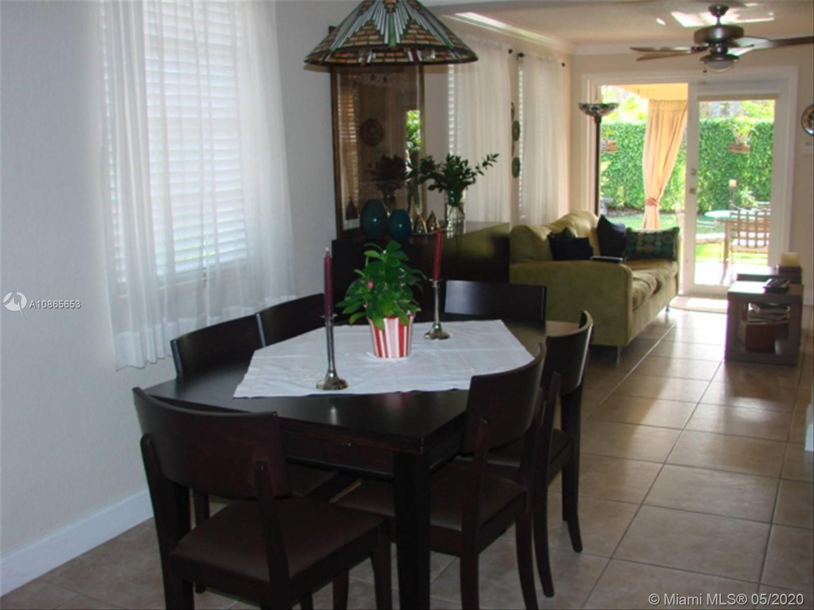 6801 Southwest 83rd Place Miami, FL 33143 - Photo 2 of 6 a view of a dining room with furniture window and outside view