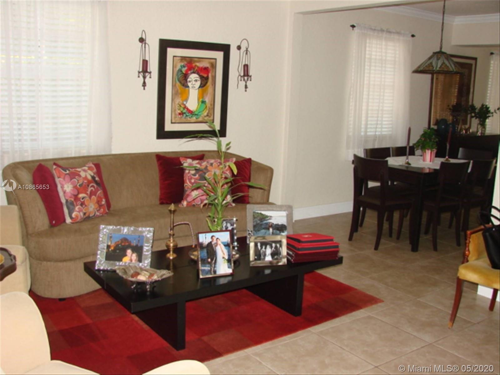 6801 Southwest 83rd Place Miami, FL 33143 - Photo 6 of 6 a living room with furniture flowerpot and a window