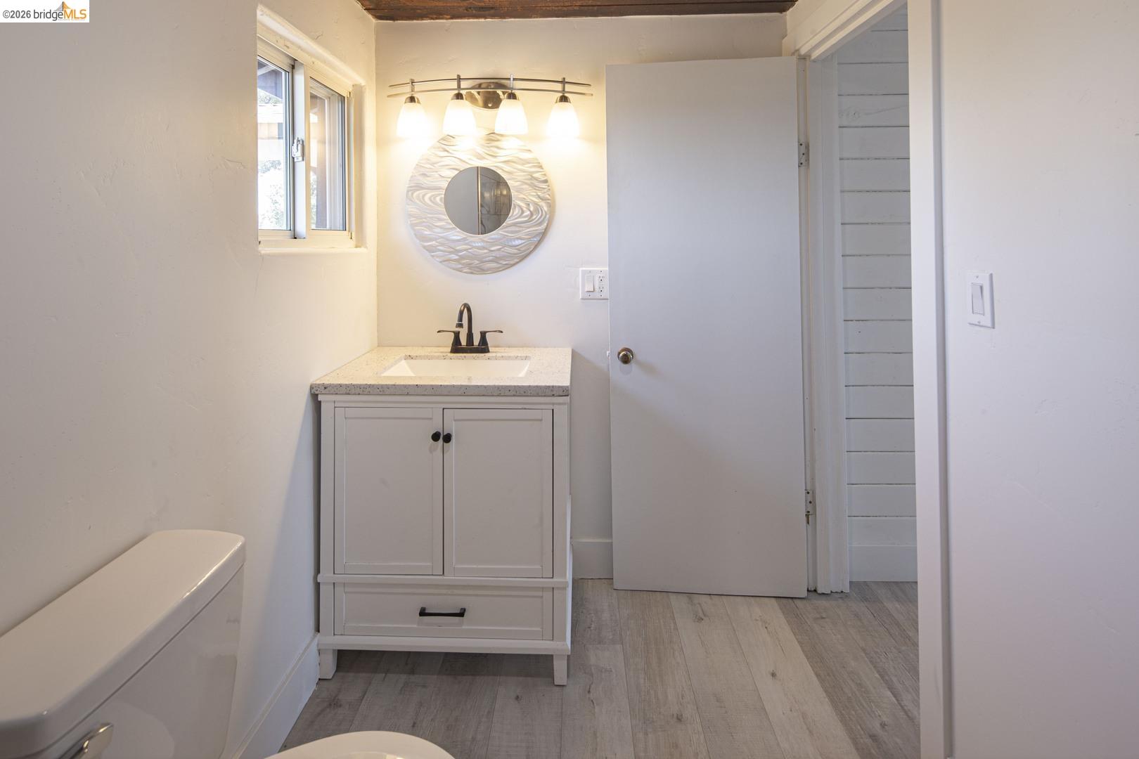 14594 Perricone Road Jamestown, CA 95327 - Photo 31 of 39 a bathroom with a sink a toilet and a mirror