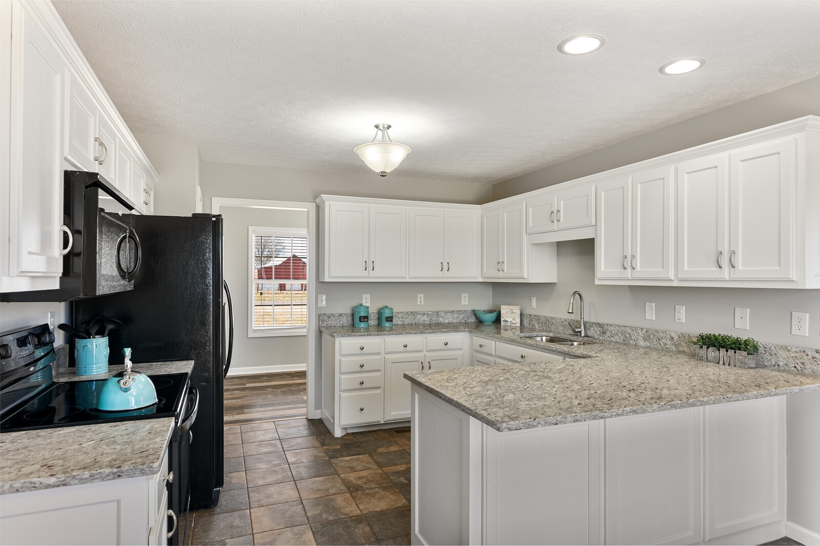 5253 Youngville Road Springfield, TN 37172 - Photo 3 of 19 a kitchen with granite countertop a sink stove and refrigerator