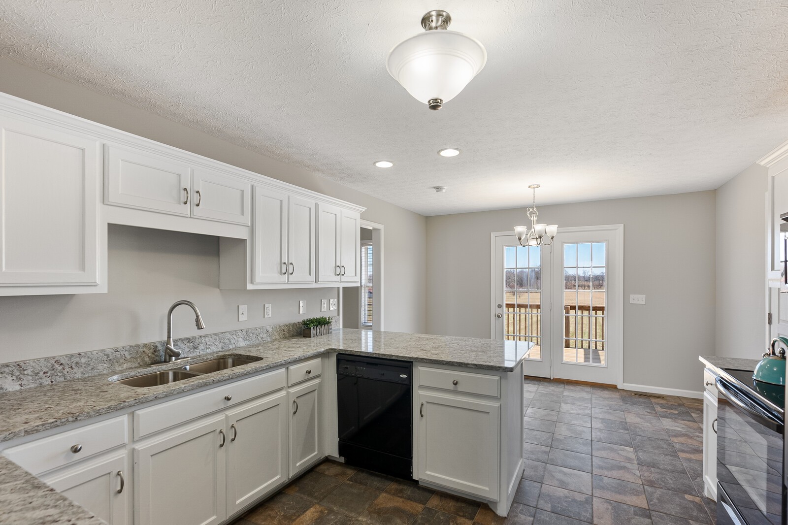 5253 Youngville Road Springfield, TN 37172 - Photo 4 of 19 a kitchen with granite countertop a sink stainless steel appliances and cabinets