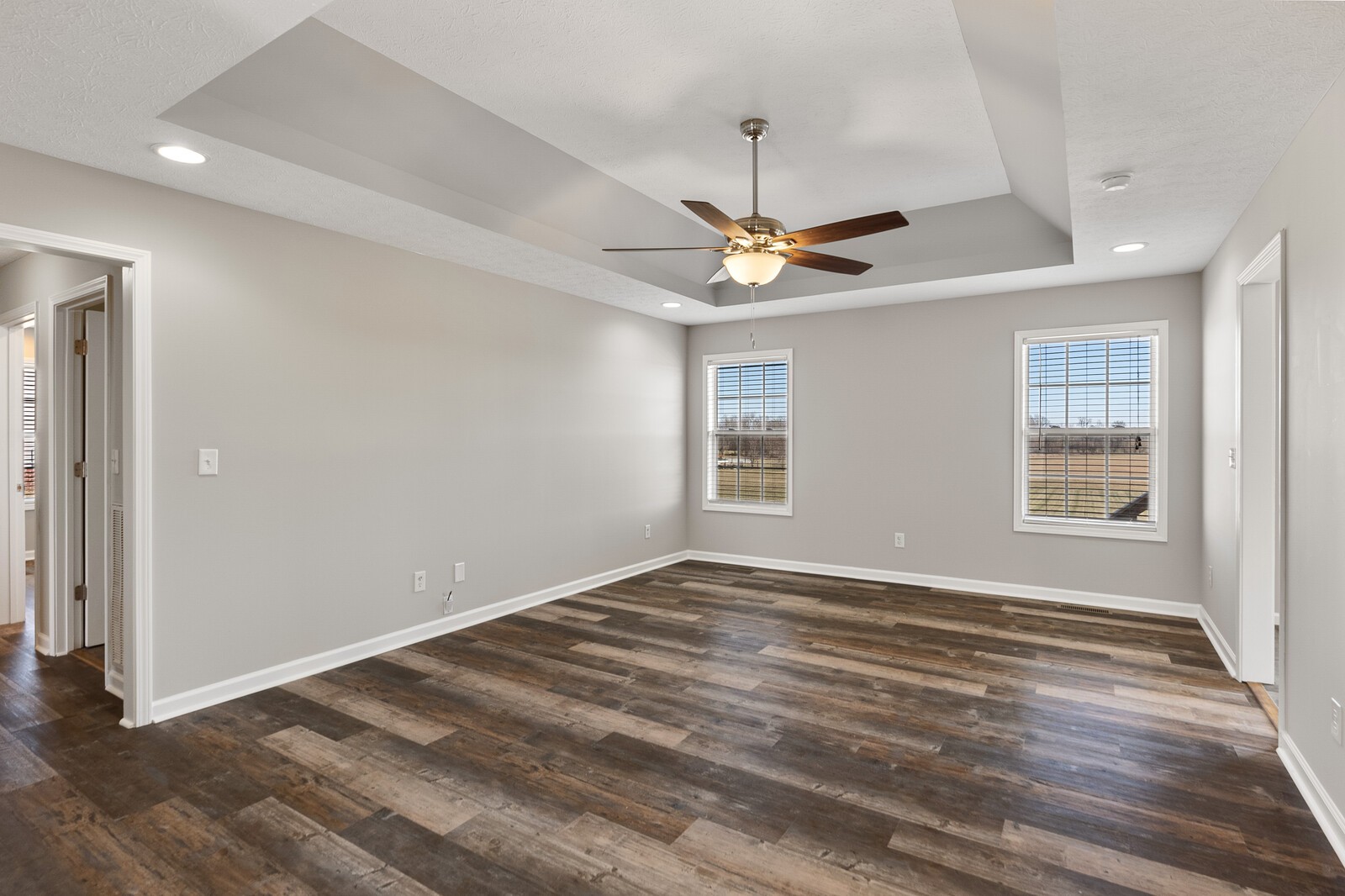 5253 Youngville Road Springfield, TN 37172 - Photo 5 of 19 an empty room with wooden floor chandelier fan and windows