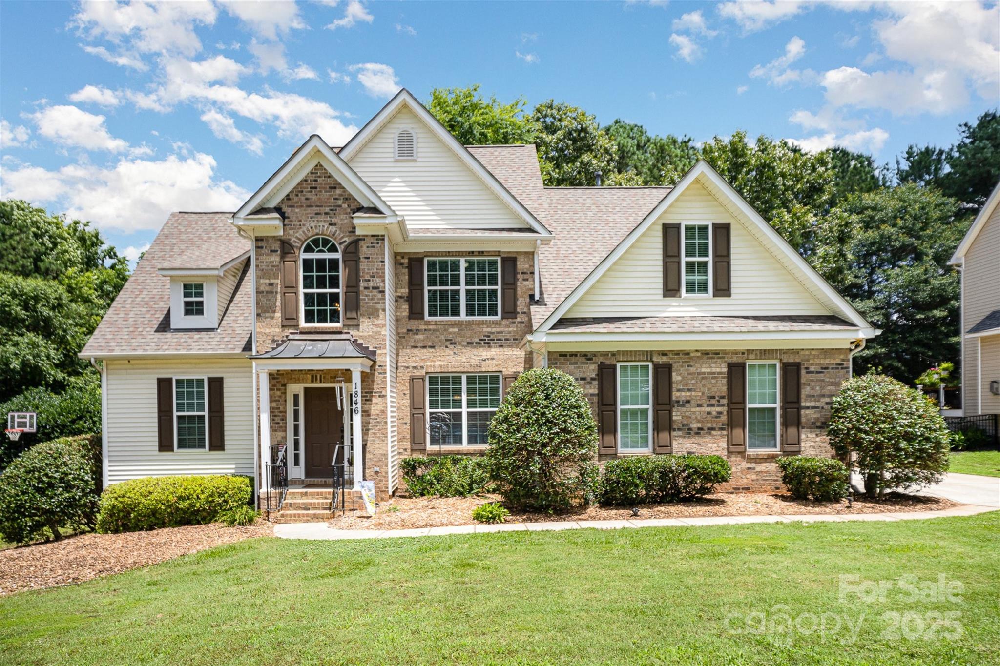 1846 Sam Smith Road Fort Mill, SC 29708 - Photo 1 of 33 a front view of a house with a yard