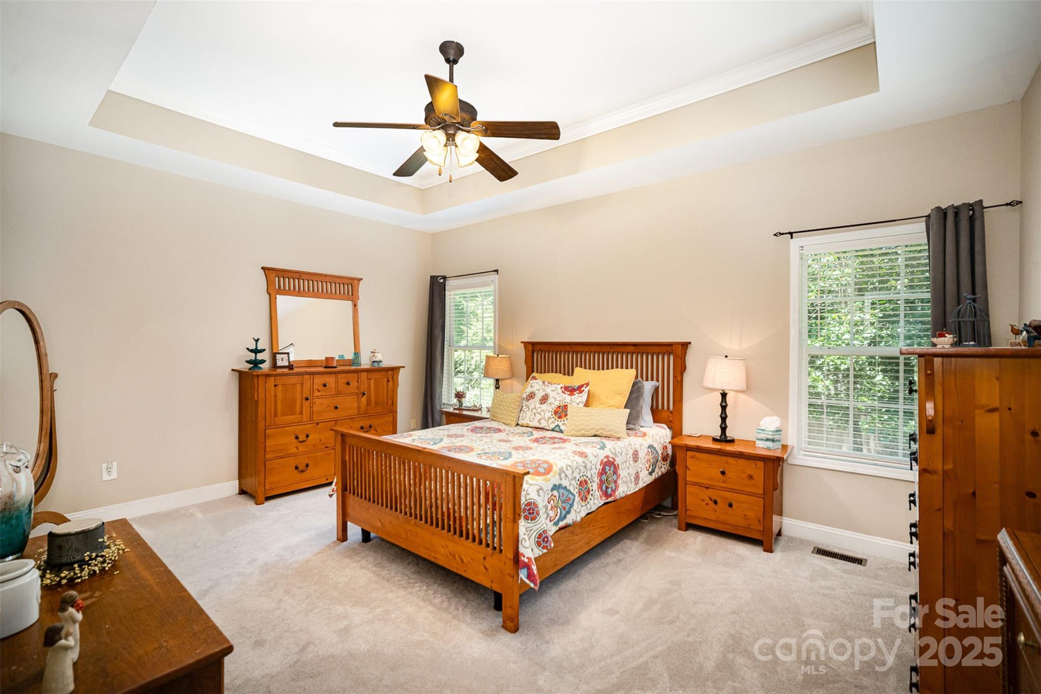 1846 Sam Smith Road Fort Mill, SC 29708 - Photo 14 of 33 a bedroom with a bed and a chandelier