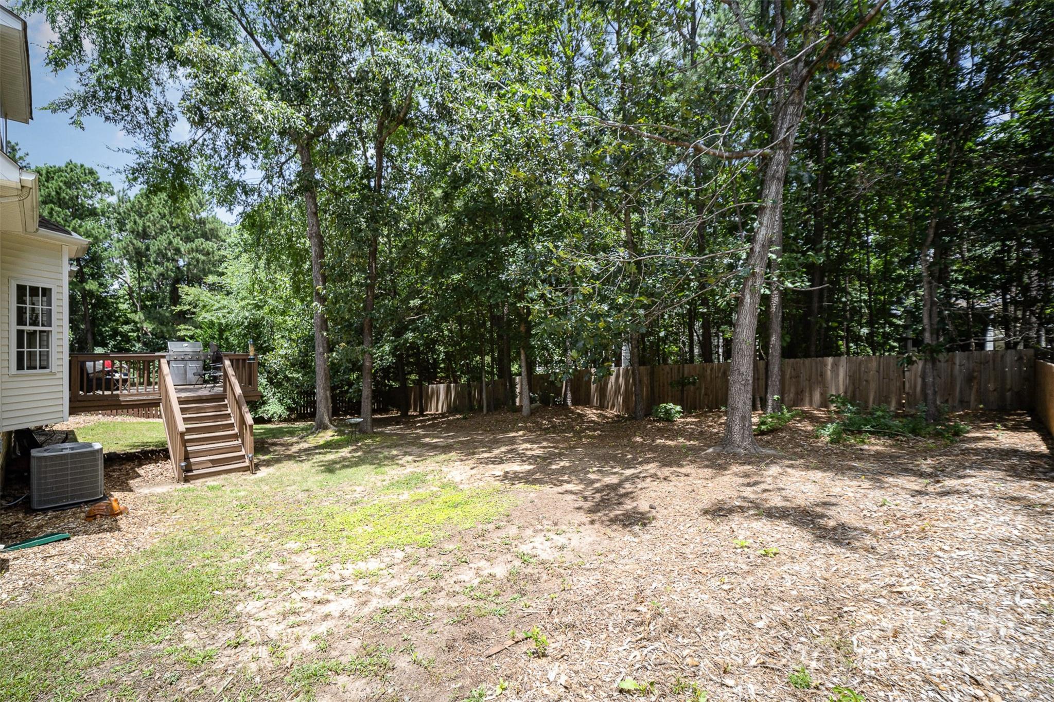 1846 Sam Smith Road Fort Mill, SC 29708 - Photo 26 of 33 a backyard of a house with table and chairs