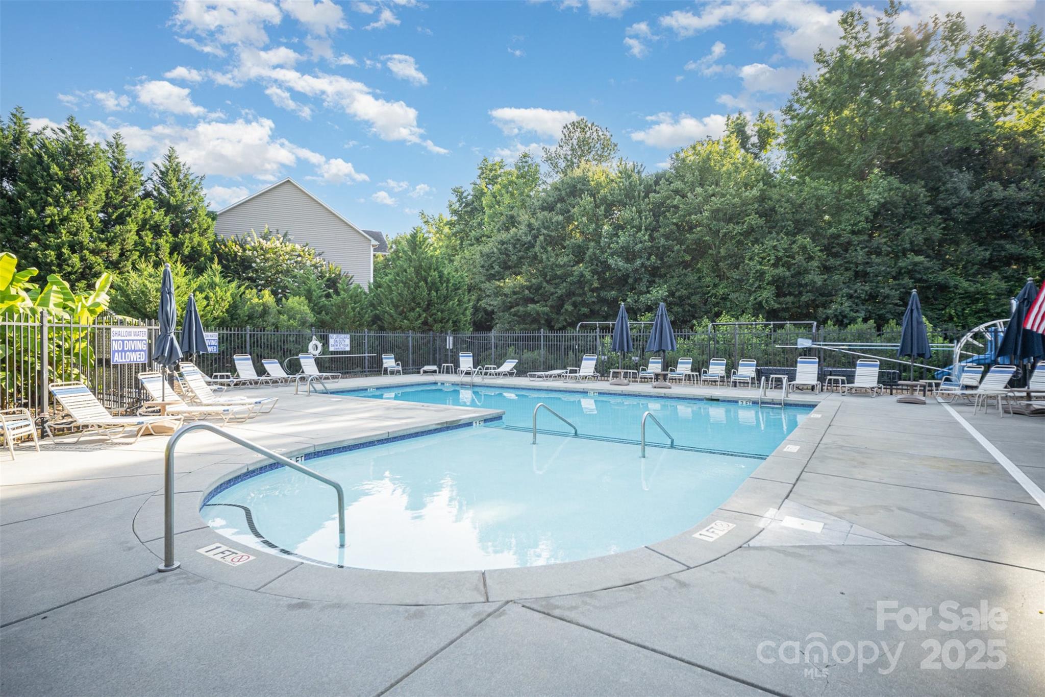 1846 Sam Smith Road Fort Mill, SC 29708 - Photo 33 of 33 a view of a swimming pool with outdoor seating and plants