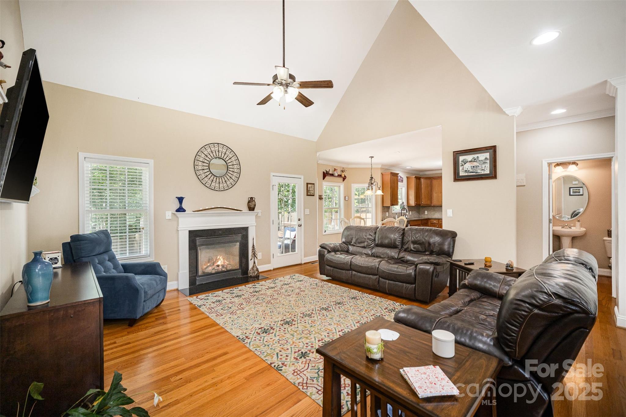 1846 Sam Smith Road Fort Mill, SC 29708 - Photo 6 of 33 a living room with furniture a fireplace and a flat screen tv
