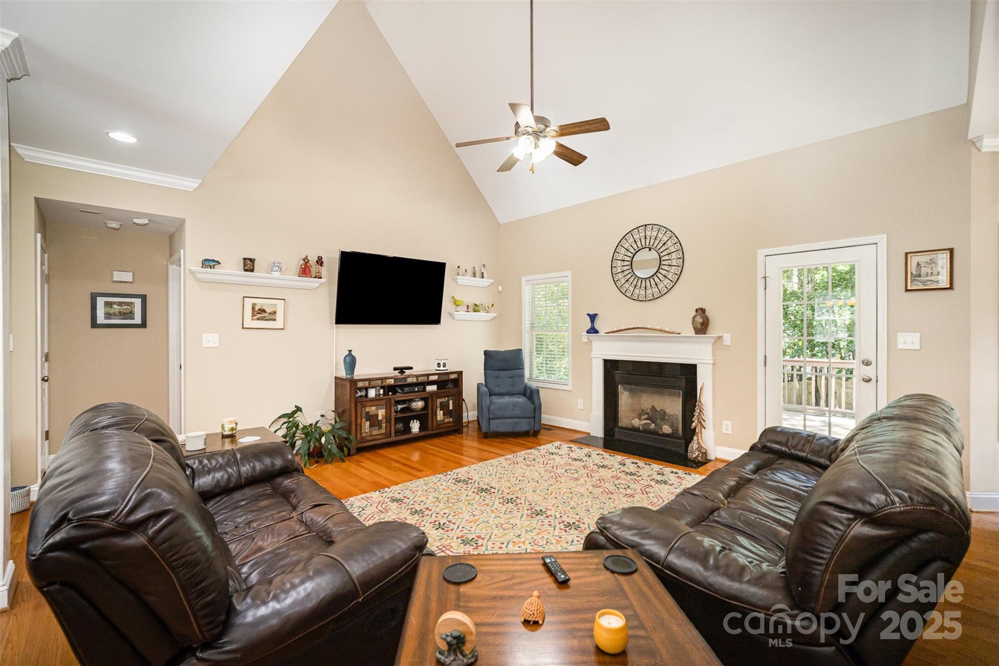 1846 Sam Smith Road Fort Mill, SC 29708 - Photo 7 of 33 a living room with furniture a fireplace and a flat screen tv