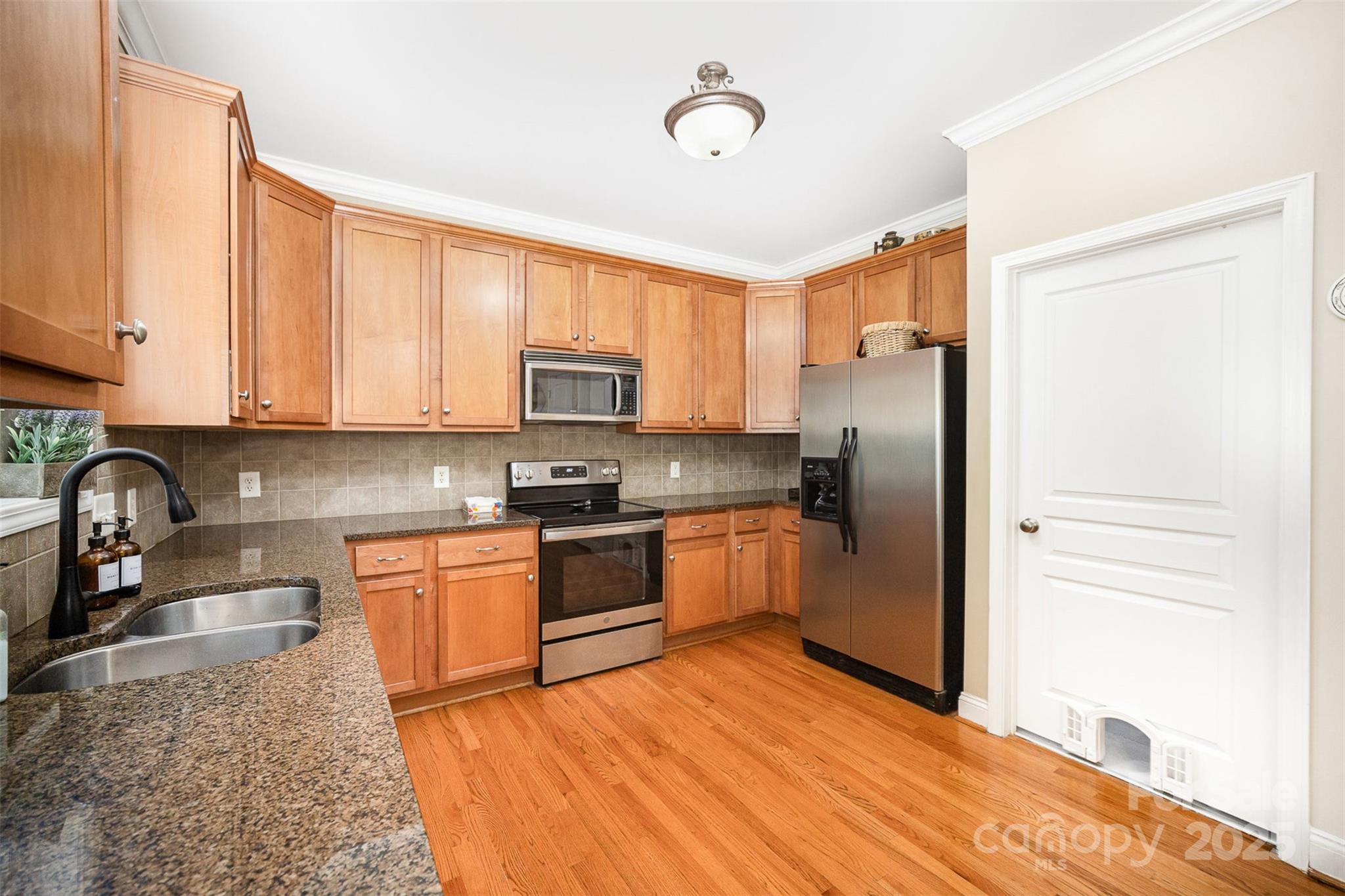 1846 Sam Smith Road Fort Mill, SC 29708 - Photo 8 of 33 a kitchen with stainless steel appliances granite countertop a refrigerator sink and stove