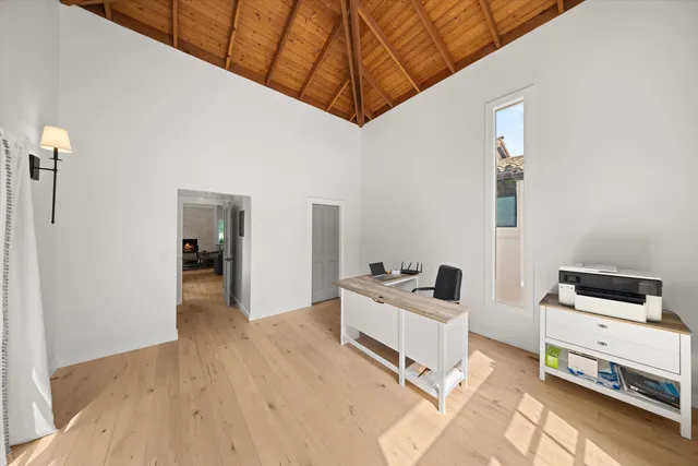 a bedroom with furniture and natural light