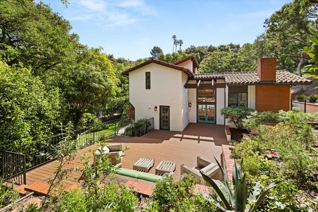 a view of house with yard and green space