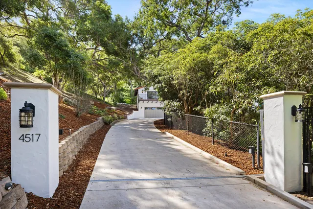 a wooden bench sitting in front of a building