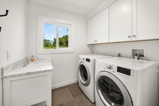 a utility room with dryer and washer