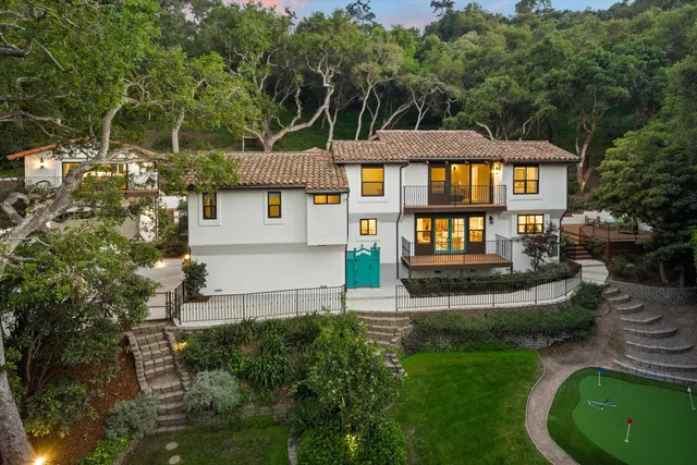 a front view of a house with a yard