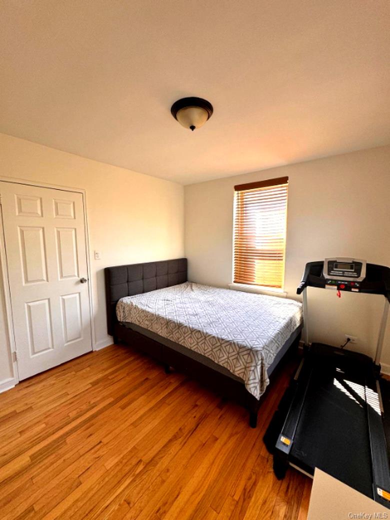 4320 Van Cortlandt Park East, Unit 6E Bronx, NY 10470 - Photo 11 of 11 a bedroom with a bed and wooden floor