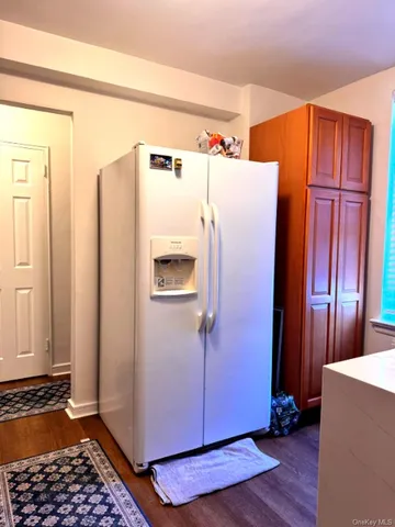 a white refrigerator freezer sitting inside of a kitchen