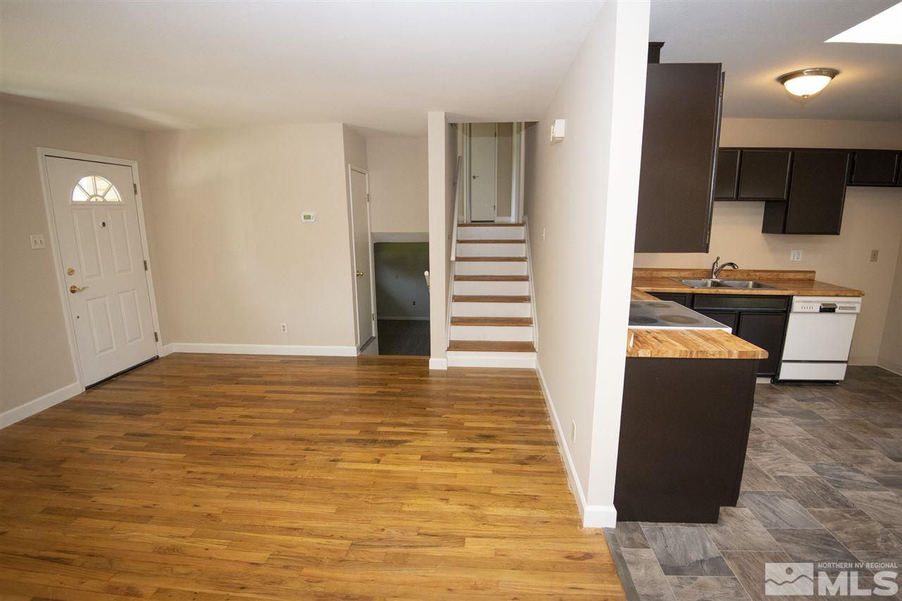 3240 Bryan Street Reno, NV 89503 - Photo 5 of 23 a view of a living room with kitchen island stainless steel appliances wooden floor and view living room