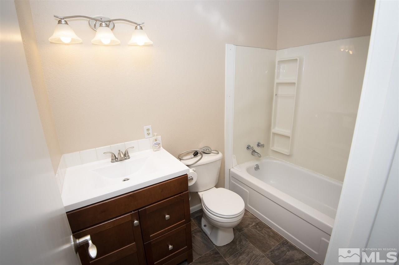 3240 Bryan Street Reno, NV 89503 - Photo 10 of 23 a bathroom with a sink a toilet and bathtub