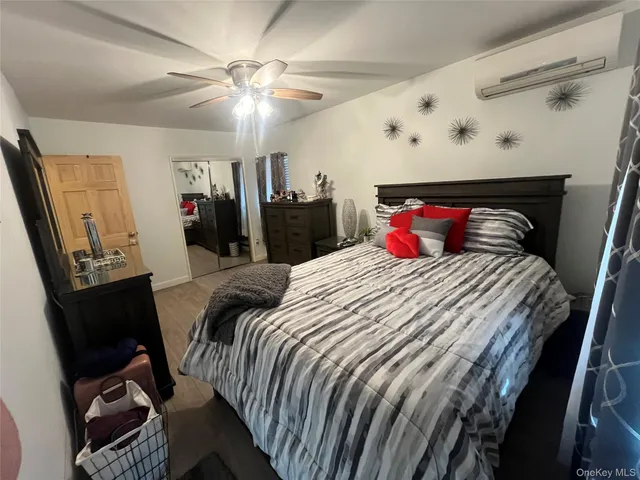 a bed room with a bed and a television