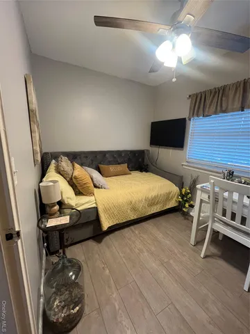 a bedroom with a bed and a chair