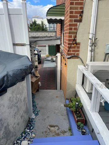 a view of a patio with table and chairs potted plants