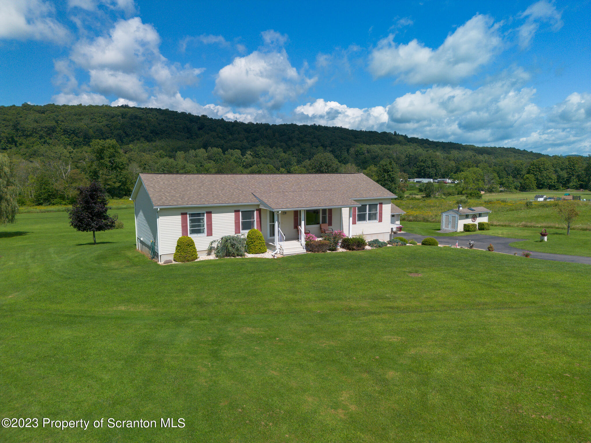 a aerial view of a house with a big yard