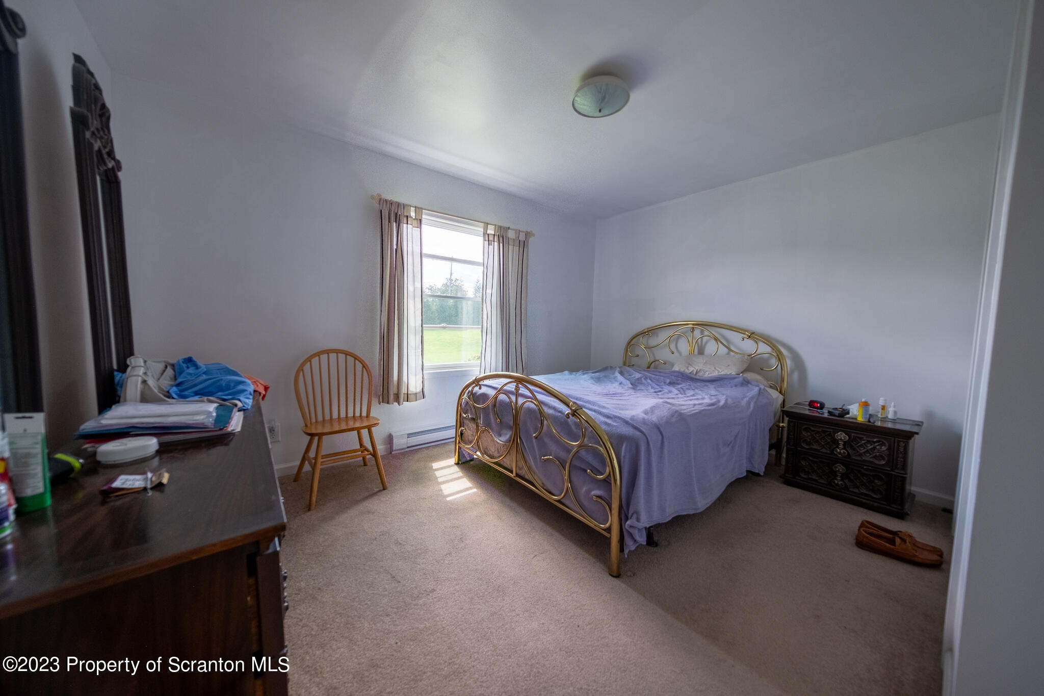 1213 Post Hill Road Falls, PA 18615 - Photo 12 of 21 a bedroom with a bed chair and window