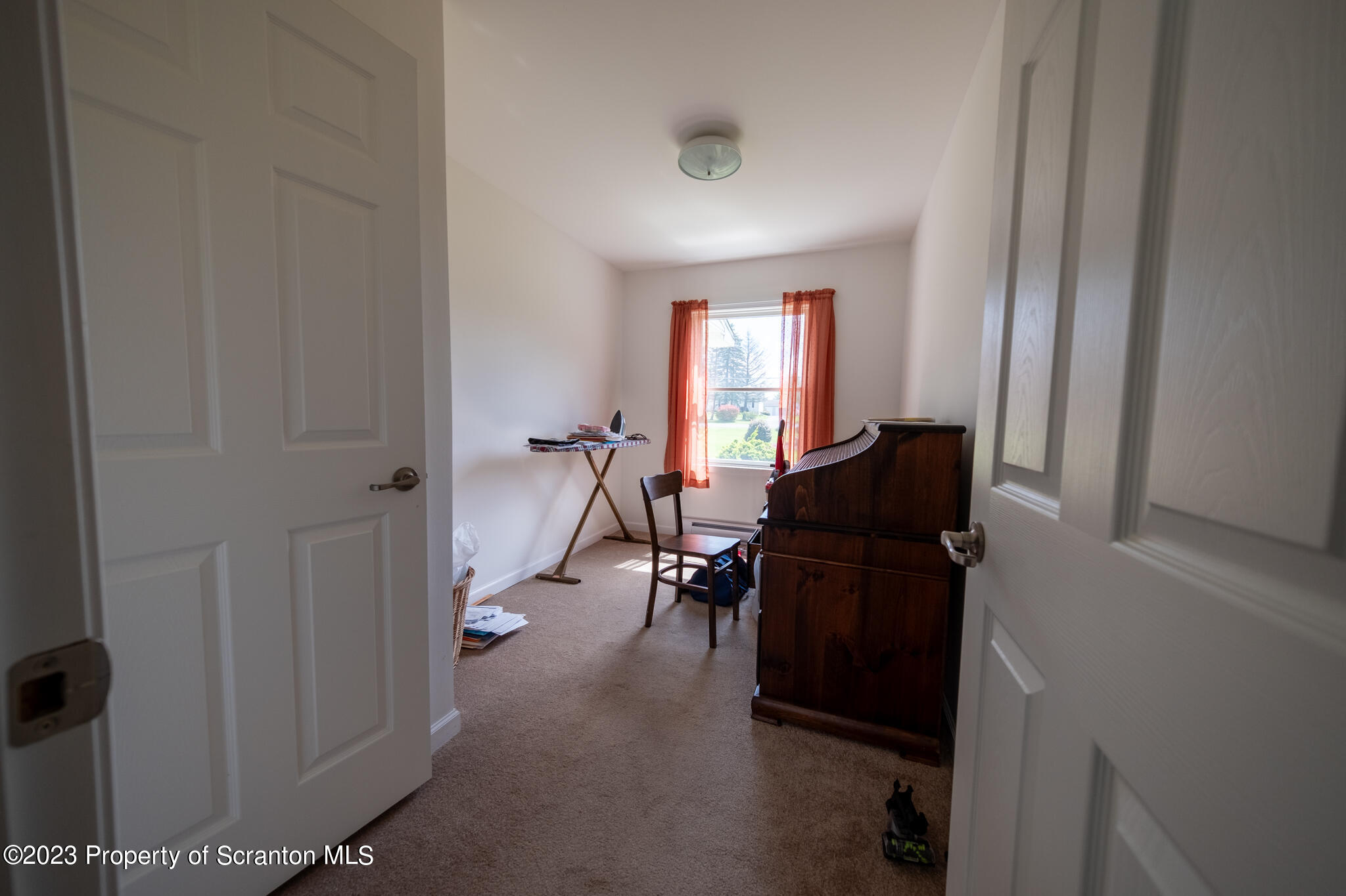 1213 Post Hill Road Falls, PA 18615 - Photo 13 of 21 a view of a hallway with workspace and windows