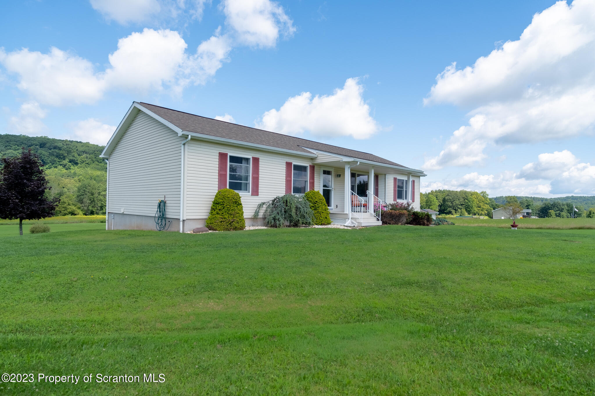 1213 Post Hill Road Falls, PA 18615 - Photo 16 of 21 a view of a house with a backyard
