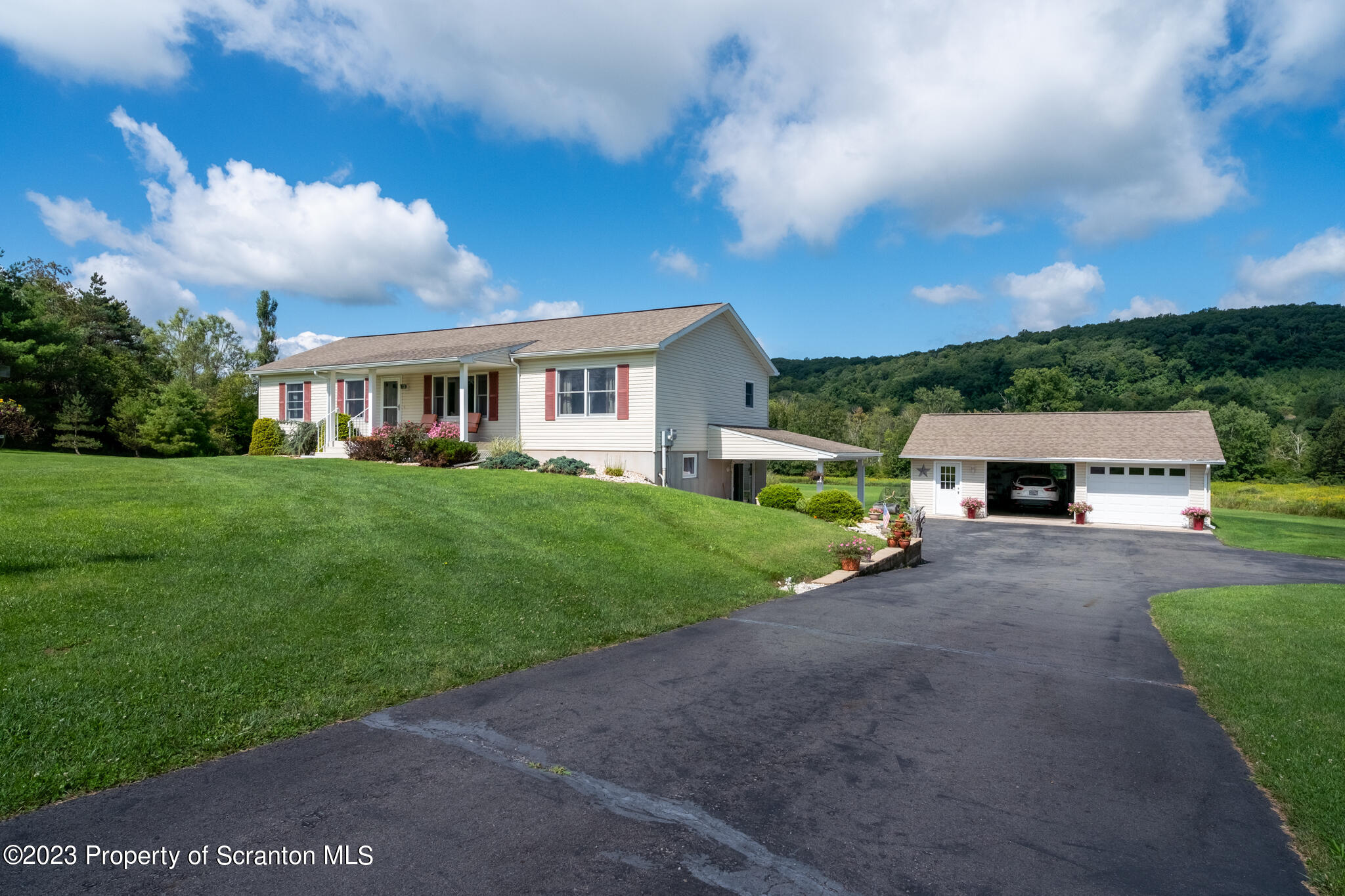 1213 Post Hill Road Falls, PA 18615 - Photo 3 of 21 a front view of house with yard and green space