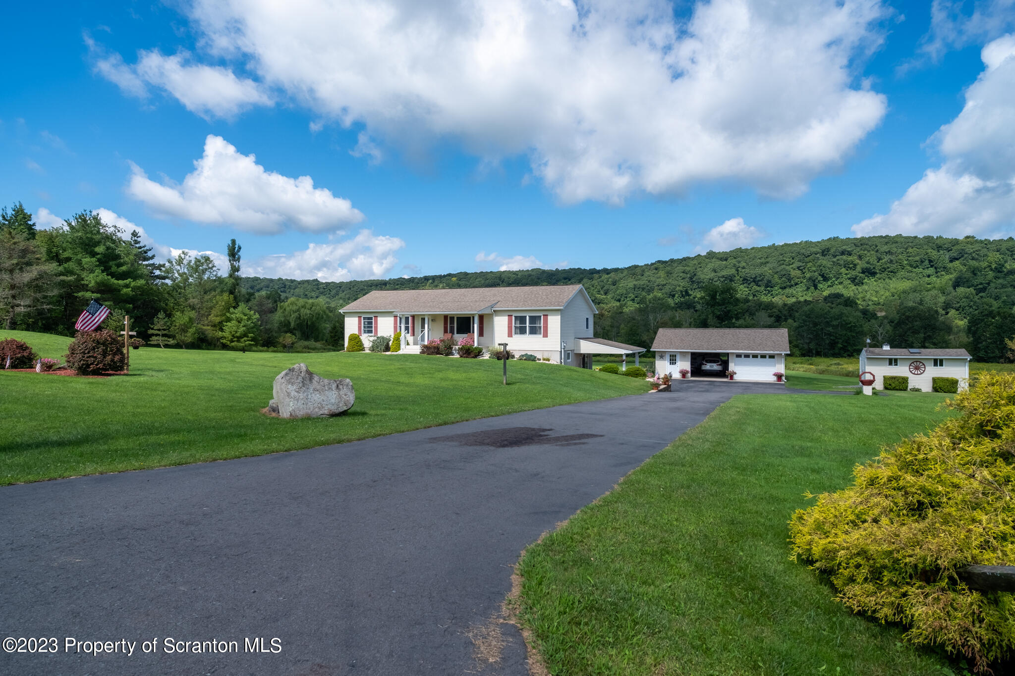 1213 Post Hill Road Falls, PA 18615 - Photo 4 of 21 a front view of a house with garden