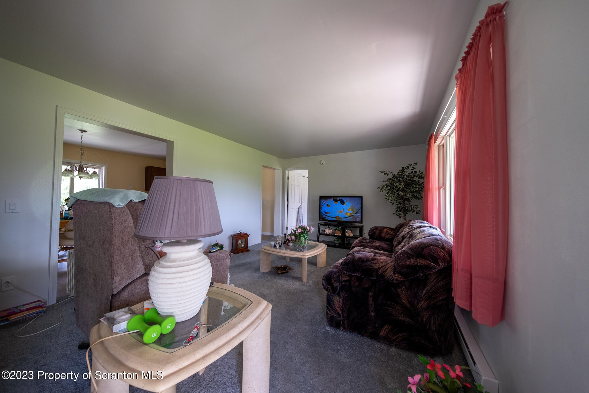 1213 Post Hill Road Falls, PA 18615 - Photo 8 of 21 a living room with furniture and a lamp